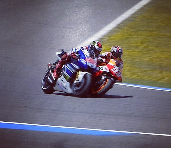 MotoGP's tweet photo. Marquez' move on Lorenzo at turn 13 at Jerez (newly named Lorenzo corner) at end of race http://t.co/FwziLsaKFi http://t.co/RcOYwJtnQi