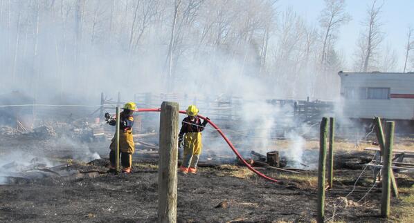 Mayerthorpe's tweet photo. Mayerthorpe firefighters fight the fire on the ground. http://t.co/e2Q2GvBn35