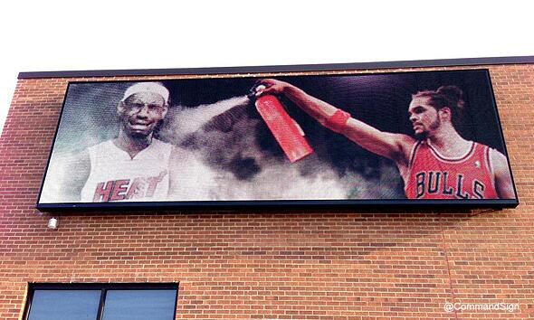 BleacherReport's tweet photo. A Chicago billboard visible from a major highway shows Joakim Noah extinguishing LeBron (h/t @treykerby) http://t.co/7vFF8wv1Xf