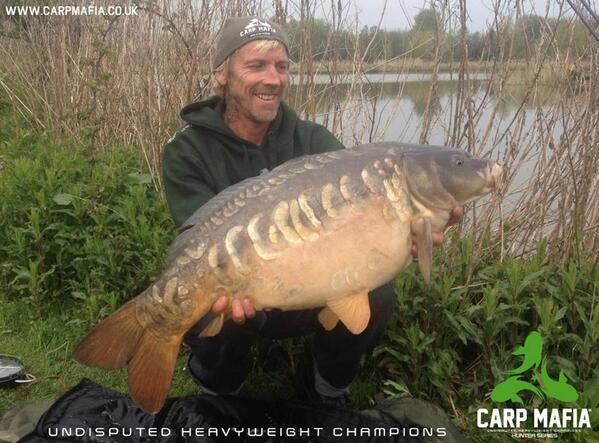 carpmafia's tweet photo. Ralph Raw Walton with his 29.5lb mirror whilst sporting his Carp Mafia hood and beanie. http://t.co/j1TDcZOIWl