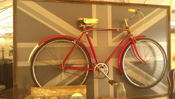 ImageOnThat's tweet image. An awesome piece of art. A vintage bike framed after it was cut in half. Found this at the Scotts antique show in Atl