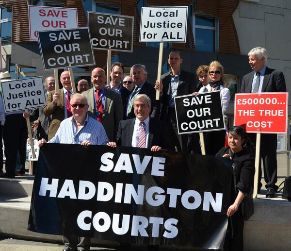 Iain_C_Gray's tweet photo. Banner says it all #saveourcourts demo http://t.co/v9lly4L1oe