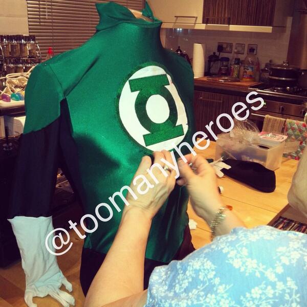 Sewing on the green lantern badge