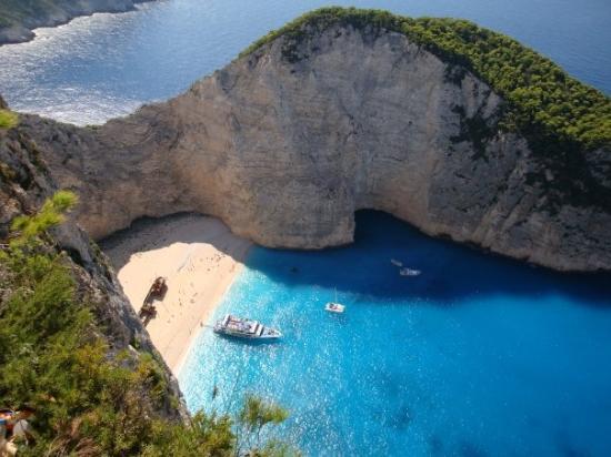 Navagio Beach, this beach is beautiful and secluded I'd feel like a water nymph playing in these crystal