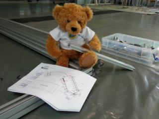 lotuscars's tweet photo. We got #LotusKett hard at work this morning in Stuttgart putting the stand together! #VeryExperienced http://t.co/SaxxzbAgCr