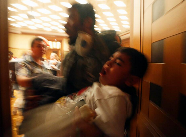 nycjim's tweet photo. Child overcome by tear gas in hotel near #GeziPark. @Reuters photo by Yannis Behrakis. http://t.co/erhvJEbAWW http://t.co/NIhpaVuWx6