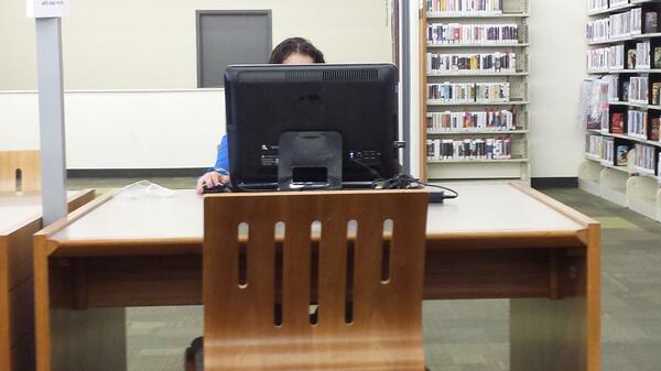 's tweet image. This lady at the public library brought her "laptop" with keyboard, mouse and all #notmobile