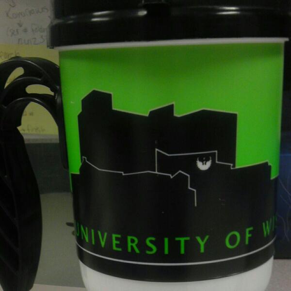 Krader06's tweet photo. Casual Friday today. Sporting my alma mater @uwgb gear and coffee mug http://t.co/t4GhvJlXKJ