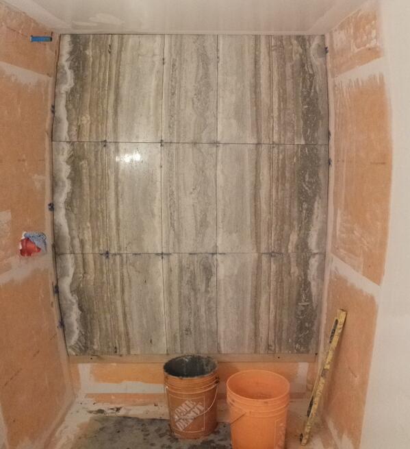 Just a photo of a shower wall installation that is currently in progress.