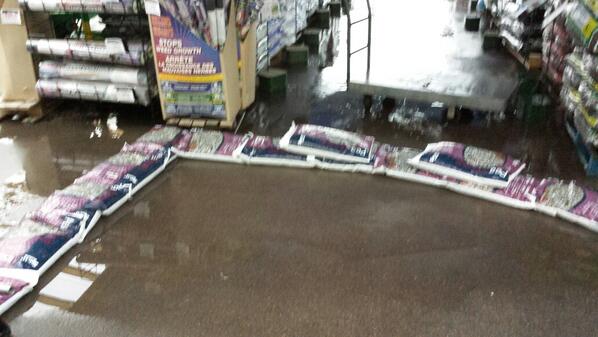 Bradchev's tweet photo. Saving the store one pea stone at a time #floodfighing http://t.co/FXlOJTrCeN