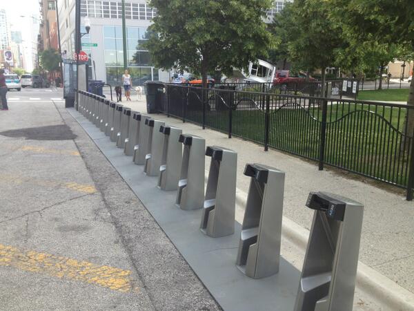 Excited to see bike sharing coming to the Chi. <a href="/DivvyBikes/">Divvy</a> station right outside the office!