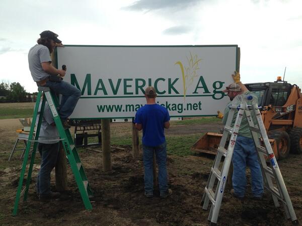 MaverickAgInc's tweet photo. Moving up in the world! Getting a sign off the highway! How many men does it take...? ;) http://t.co/C4cp99lMvc