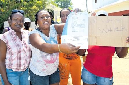 people in jamaica protesting "we want water"