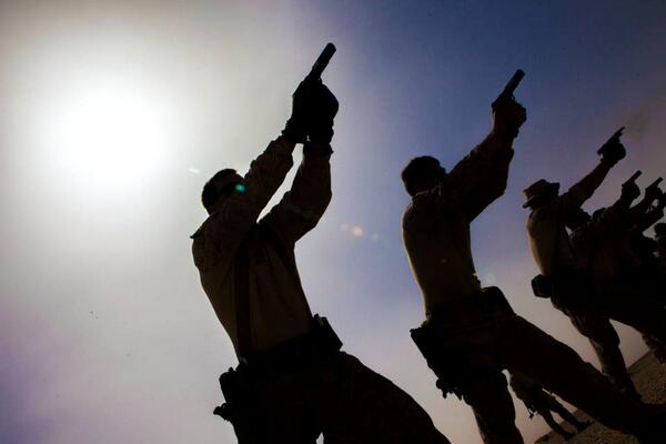 USMarineCorps's tweet photo. PHOTO: @26MEU #Marines fire their pistols during #ExerciseEagerLion. http://t.co/ffahh1SW4D