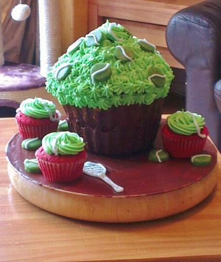 Big Johns Tennis themed birthday cake the filling is vanilla,red velvet cake, choc covered base and buttercream top..