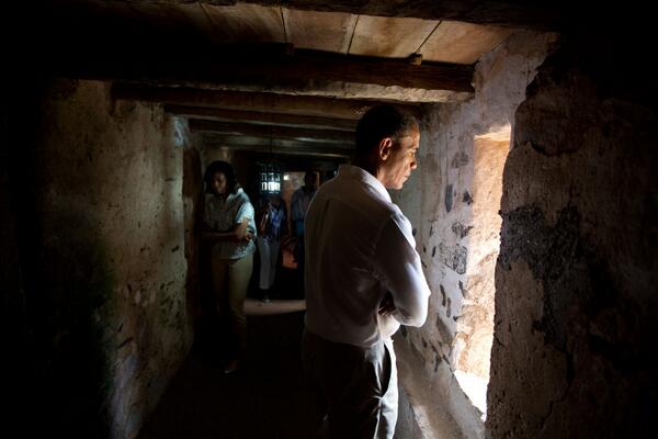 PeteSouza44's tweet photo. President Obama looks out prison cell window on Goree Island http://t.co/2kJ9C1JLMm
