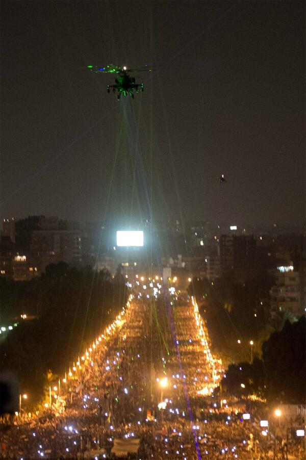SpaceCadetLtd's tweet image. "#EgyptProtestors hit Helo With #LaserPointers via @mashable" I know how dangerous this is BUT this pic is #amazing!