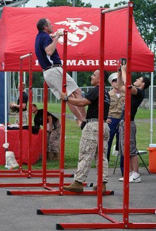 PingryAthletics's tweet photo. Director of Athletics Gerry Vanasse warmed up for the Basilone Bowl via the Marine Corps version of the "bar exam." http://t.co/HjTn56Lhja