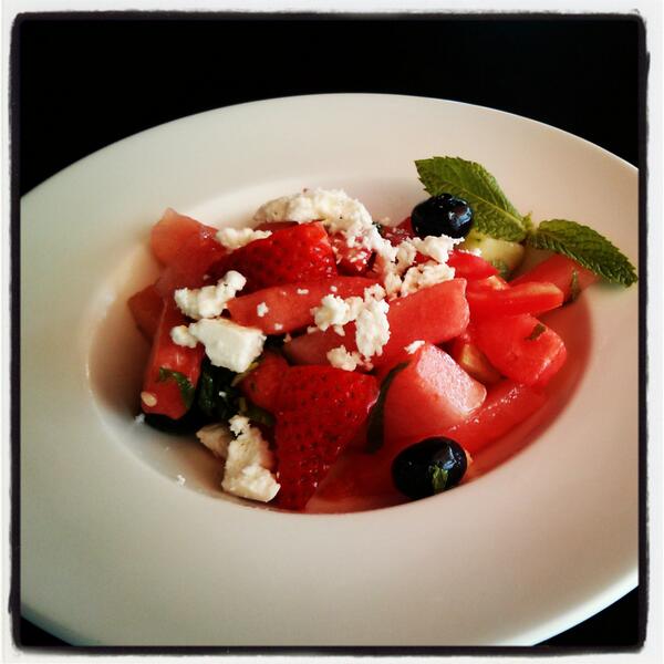 It's hot out there. Our new heirloom tomato and watermelon salad w/ strawberries, mint &amp; Feta will cool you down