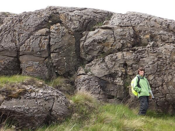UoPIsleOfRum's tweet photo. Wow, way to get messed up geology... Lem enjoying being a scale model :-) ~Stef #UPEarthDissfieldwork #geology #rocks http://t.co/sMQ3O5NRk7