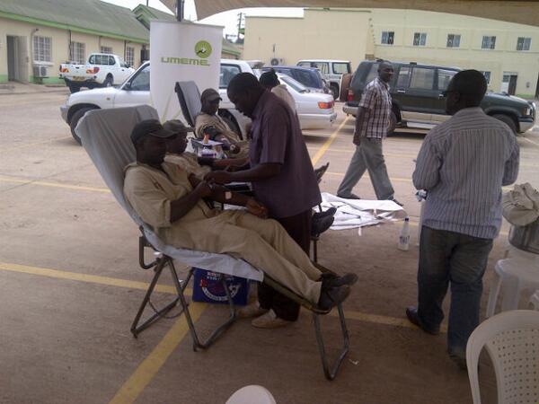 SIlungole's tweet photo. Umeme's men in overalls doing their thing in the Lugogo venue! Join us &amp; save a life! http://t.co/thkXc4GEN3