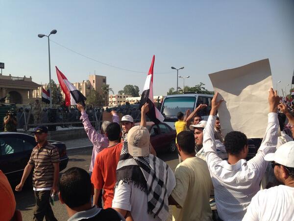 sharifkouddous's tweet photo. Tense standoff at officers club after troops open fire on pro-Morsi crowd http://t.co/MBIumj9u2G