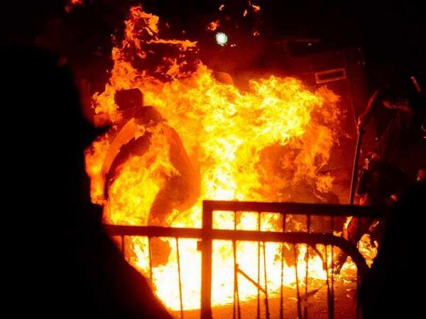 YourAnonNews's tweet photo. image from AP: "someone just threw a molotov cocktail at the police in Rio." #PopeFrancis http://t.co/Y7BuJV8Tbs