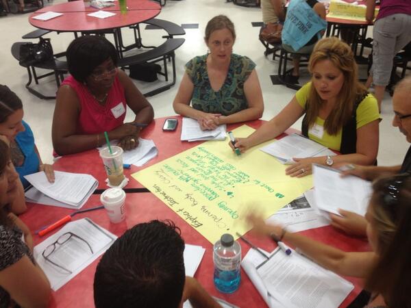 Teachers from UP! Schools discussing effective classroom learning structures.