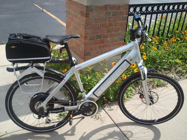 Silver Stromer electric bike with all the goodies... Topeak beam rack, bag w/ fold out panniers, fenders &amp; lights...