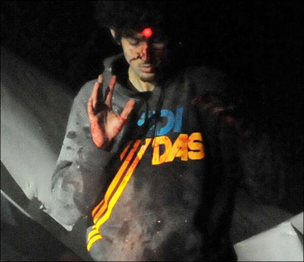 RealAlexJones's tweet photo. Photo of Boston suspect, Dzhokar Tsarnaev, allegedly surrendering http://t.co/eQD0h28xUq Notice no throat wound http://t.co/i8e8tDopHe