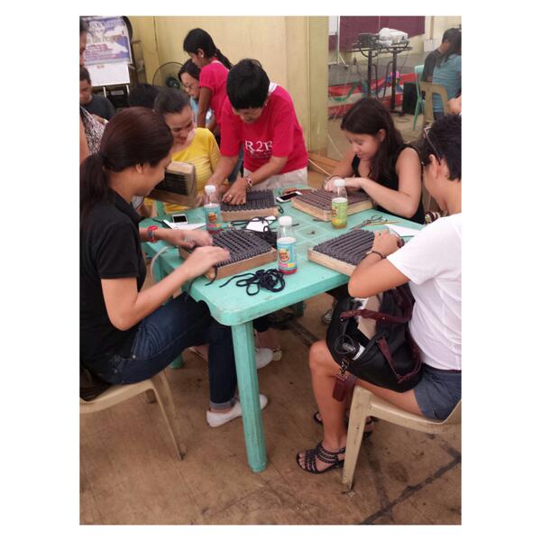 Its <a href="/kellymisa/">Kelly Misa-Fernandez</a> <a href="/aminaaranaz/">amina aranaz</a> @thesansinator <a href="/OliviadAboville/">Olivia d'Aboville</a> learning how to weave at the #Rags2RichesOpenHouse. :)