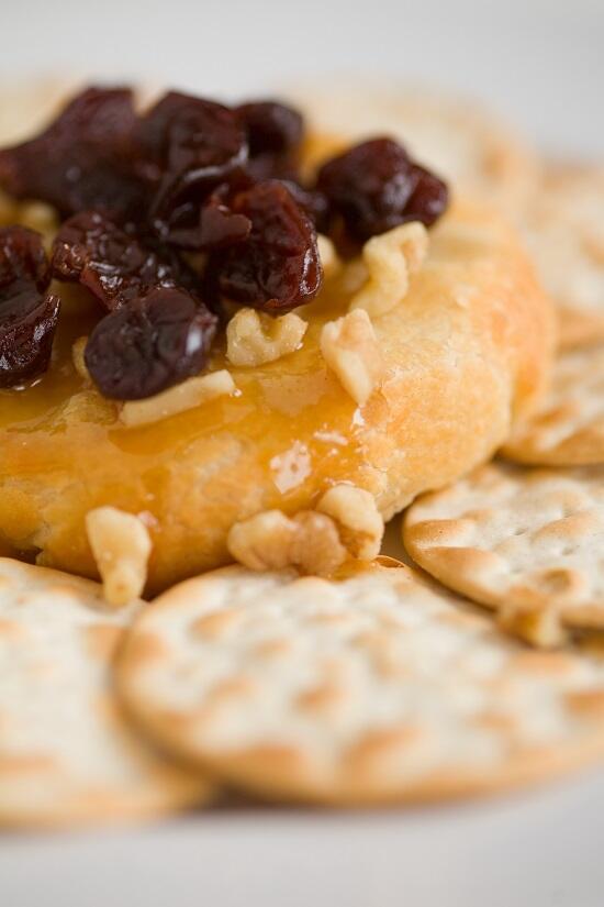 Not the average cheese and crackers! This is our Baked Brie w/ dried cherries, walnuts, &amp; drizzled w/ a caramel glaze