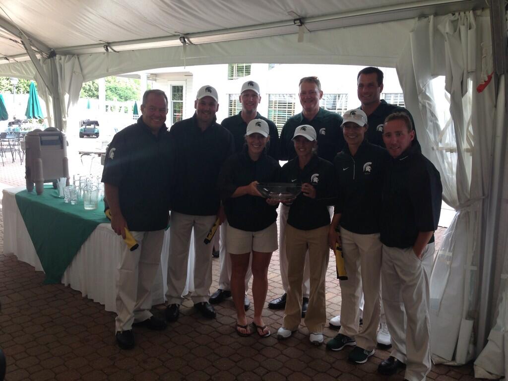Spartan team poses with Championship Trophy
