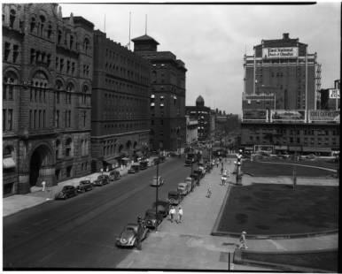 Looking East on Farnam St, Courthouse courtyard in foreground, old First National Tower in background-1937. #Omaha