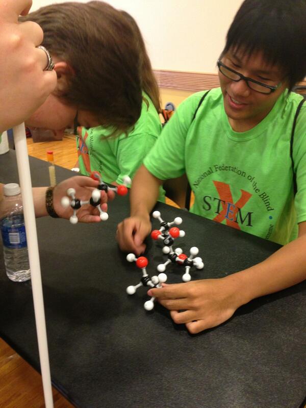 #nfbstemx Chemistry students showing other blind students their work using tactile models of molecules