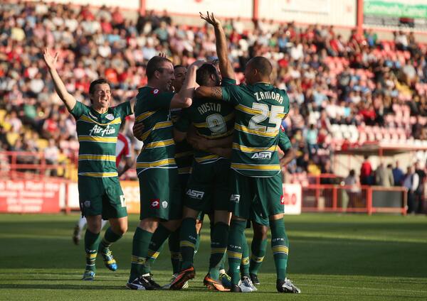 QPR's tweet photo. ACTION SHOT: Goalscorer Charlie Austin is congratulated by his #QPR team-mates after his early goal #EXEvQPR http://t.co/wThpgQwnMt