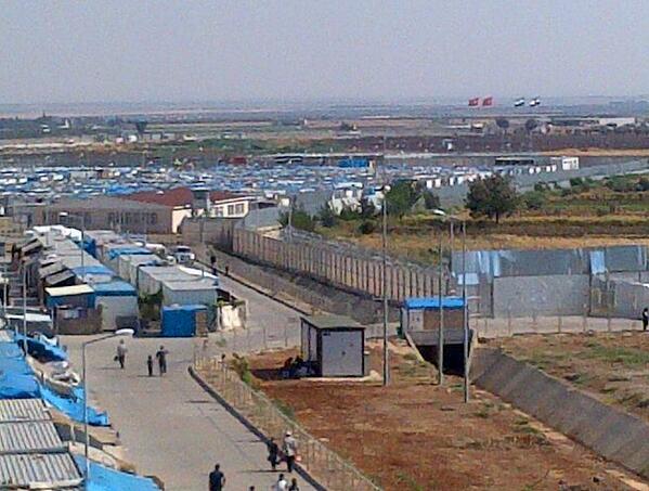 Mobisher's tweet image. Border of #Turkey &amp;amp;amp; #Syria easily visible from the Kilis oncupinar refugee camp.