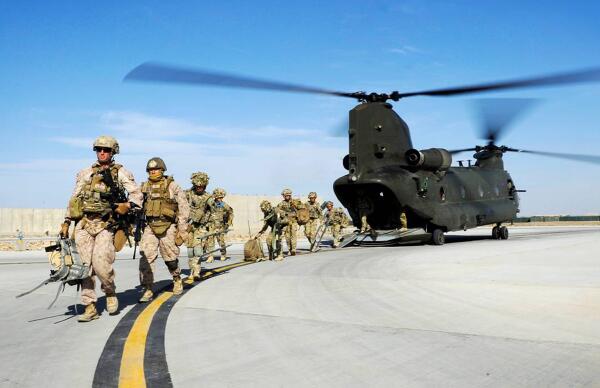 RAF Regiment Gunners &amp; US Marines exit an RAF Chinook returning to Camp Bastion after carrying out a joint patrol.