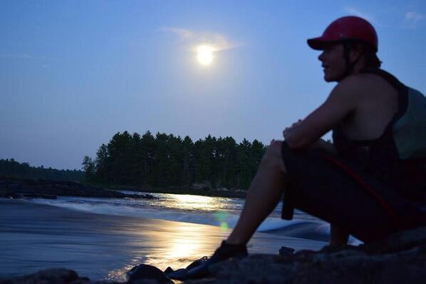 PetawawaRaft's tweet photo. We went for a session on the #ottawariver tonight. Here Graham takes a break from #playboating as the moon rises. http://t.co/E9Hq0Ee36j