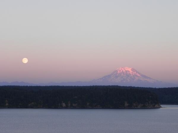 Full Sturgeon moon rising near Mount Rainier this evening, as seen from Anderson Island. (Photo: Robert Lyden)