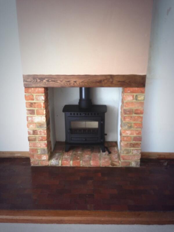 Fantastic stove installation with false chimney breast by Kelvin Fireplaces