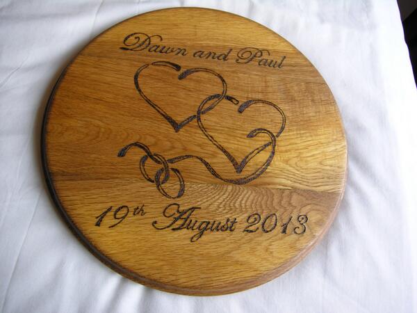 an oak breadboard decorated with pyrography commissioned as a wedding presi. mtcrafts.co.uk