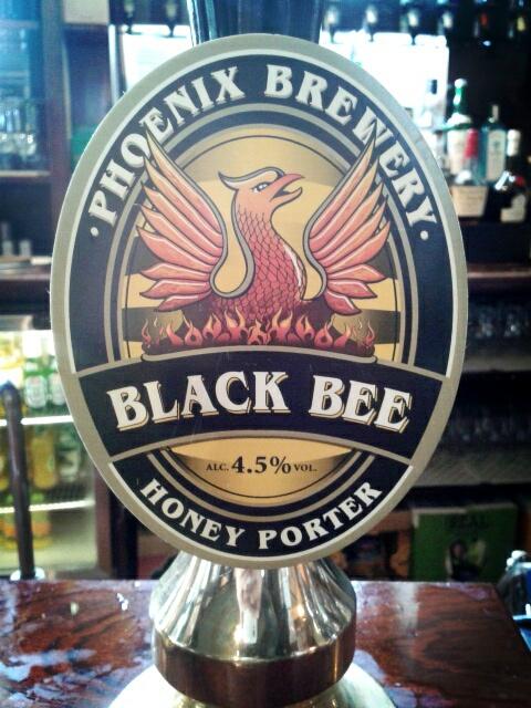 TheThreePigeons's tweet photo. @PhoenixBrewery_ 's Black Bee on the bar to help us get through this miserable weather. It certainly is helping. Yum. http://t.co/9jc8q6IRHL