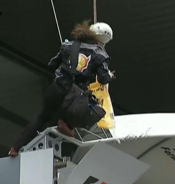 GreenpeaceUK's tweet image. Wondered why everyone was looking up? Protesting Shell's Arctic drilling above the winner's podium #formulashell #f1