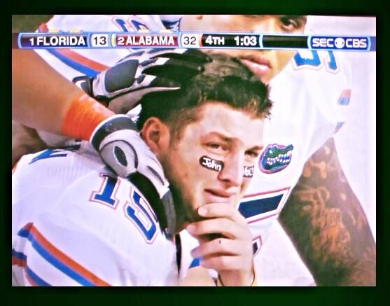 IconicSports's tweet photo. A crying Tim Tebow in consoled by teammates during 2009 SEC Championship http://t.co/Pbq3Em2KS7