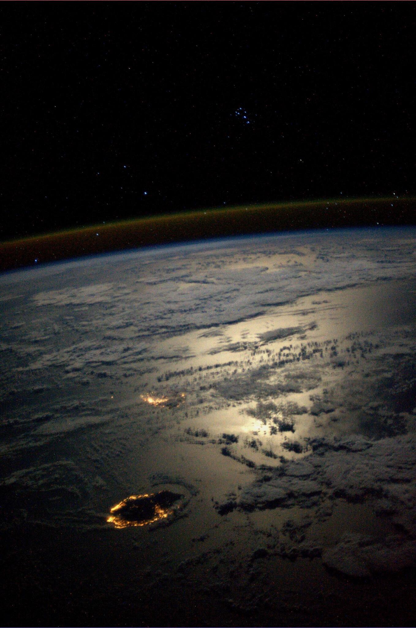 Seven Sisters overlooking Reunion & Mauritius Islands in a moonlit Indian Ocean.