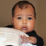 Badoksi's tweet photo. @kanyewest Kanye West proudly introduced him and @KimKardashian daughter North to the world. #Cute http://t.co/D2THDDJPKv
