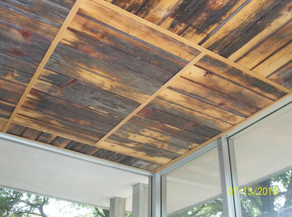 Brown burnt wooden celling, reclaimed from old barns in Wisconsin. Just one of our many commercial projects!