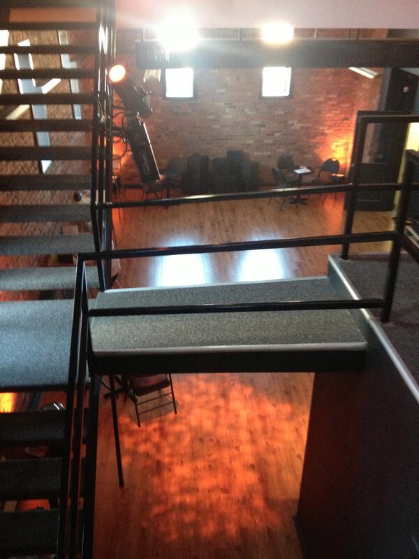 The 60 foot ceiling is the former fly gallery of the original theatre