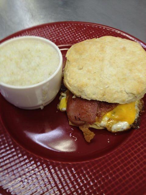 Our Country Ham Biscuit w/ fired egg, cheese, and grits!